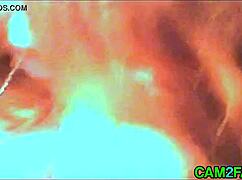 In this amateur video, a redhead's tits take center stage during passionate sex