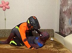 spiderman and motocross guy are hooking up in this gay scene