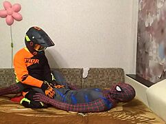 spiderman and motocross guy are hooking up in this gay scene