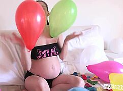 Ever seen a pregnant star strip bare with balloons and bubbles?