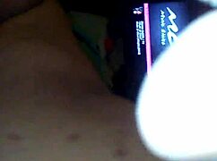 In a retro blue film, she rides his cock with her ass on display