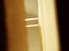 I spied on the prostitute shaving her hairy pussy in the hidden spot.