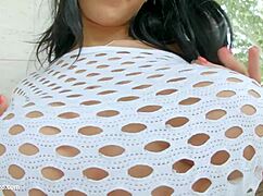 Kyra Hot playfully inserts dildo between her big natural tits