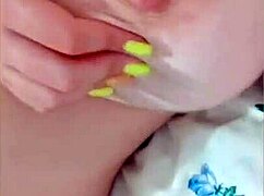 Young maid flaunts big tits for boss in close-up video.