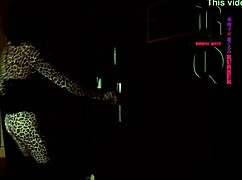 this doll is bound in latex with a condom and mask under control