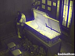 Watch This Couple Get Caught Fucking Hardcore In A Coffin!