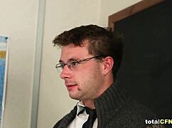 Three hot students can't resist stroking their teacher's hard cock in class.