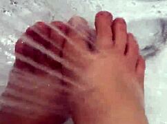 I slip off my nylon stockings and step into the shower for a footjob.