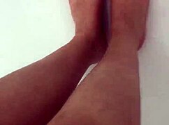 I slip off my nylon stockings and step into the shower for a footjob.
