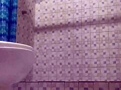 Hidden camera in shower spying on mature stepmother's big tits and ass