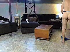 horny gay nudist sweeps the house while stroking his hard cock.