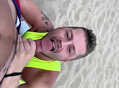 Hey, wanna see a hot gay blowjob on the beach?