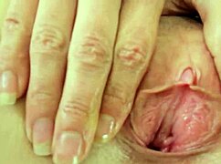 Can you believe this solo girl talking dirty while finger fucking her gorgeous pink cunt? She teases with wet pussy and tight details in homemade video.