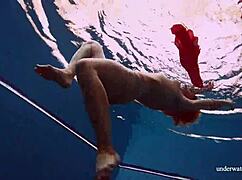 I watch Avenna swim nude, her tight pussy exposed