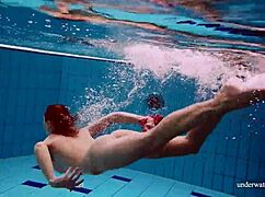 I watch Avenna swim nude, her tight pussy exposed