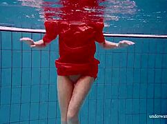 I watch Avenna swim nude, her tight pussy exposed