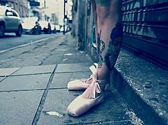 Ballerina strolls in ballet shoes on the street