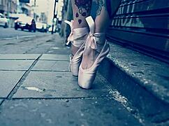 Ballerina strolls in ballet shoes on the street