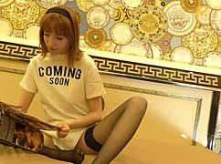 Skinny redhead in black stockings teases tight pussy on bed. Gets ignored and bored.