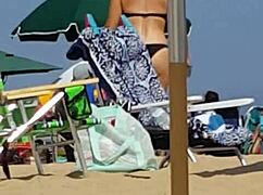 check out this candid video of a little 18+ girl in bikini at the beach