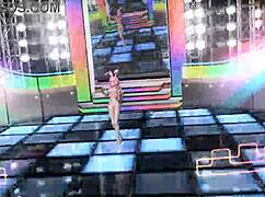 Megurine Luka poses nude in a full bunny costume.