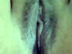 gina with pink hair in her living room