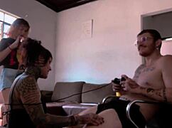 Behind the scenes, naked woman sucks Carmona while playing video game