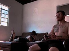 Behind the scenes, naked woman sucks Carmona while playing video game