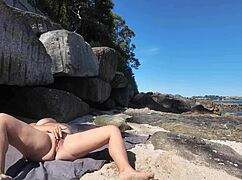 curvy nudist flashing her hairy pussy on the beach