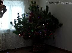 Teen bitch dances naked around the Christmas tree showing tits and ass