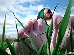 Goddess feet in cute white socks spread on spring grass field
