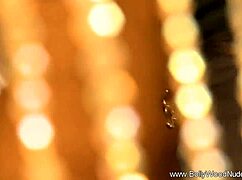 The brunette indian girl performs a teasing striptease, undressing and dancing nude