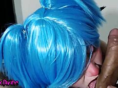 Blue haired goth cosplay slut in lingerie and fishnets sucks huge interracial cock intriguingly.