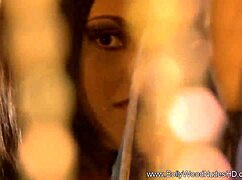 The brunette indian girl performs a teasing striptease, undressing and dancing nude