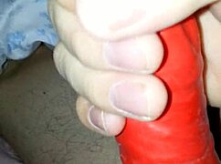 a husband tries on a latex suit with a sheath for his amateur costume.