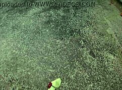 African pornstar walks barefoot on beach and street, dirtying feet.