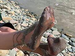 Imagine the goddess revealing her messy nylon feet in torn pantyhose by the river bank, toes wiggling close up