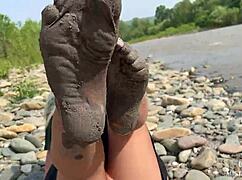 Imagine the goddess revealing her messy nylon feet in torn pantyhose by the river bank, toes wiggling close up