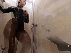latex-clad mistress teases in shower with nylon leggings and body