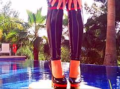 latex-clad mistress teases in shower with nylon leggings and body