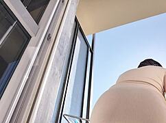 hot latina shows ass and pussy on balcony without panties