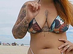 young african girl flashes on usa beach to attract attention