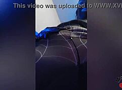 sexy spiderbabe in halloween costume teasing with contrasts