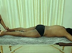 Asian Indian Woman Receives Full Body Oil Massage In Traditional Spa Setting With Relaxing Techniques