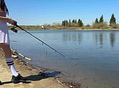 Young angler girl fishes in forest miniskirt fishnets 😏