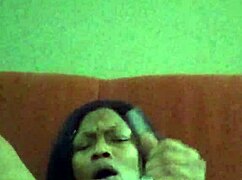 Ebony beauty with hairy pussy making herself creamy through intense self-pleasure