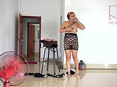 chick tries on linen and dresses at the resort