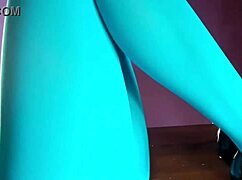 Milf in pantyhose lies on table.