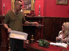 Stacey Saran receives a delivery from the office courier in a professional setting