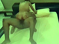 Camera catches young wife cheating with neighbor in detailed intimate scene.